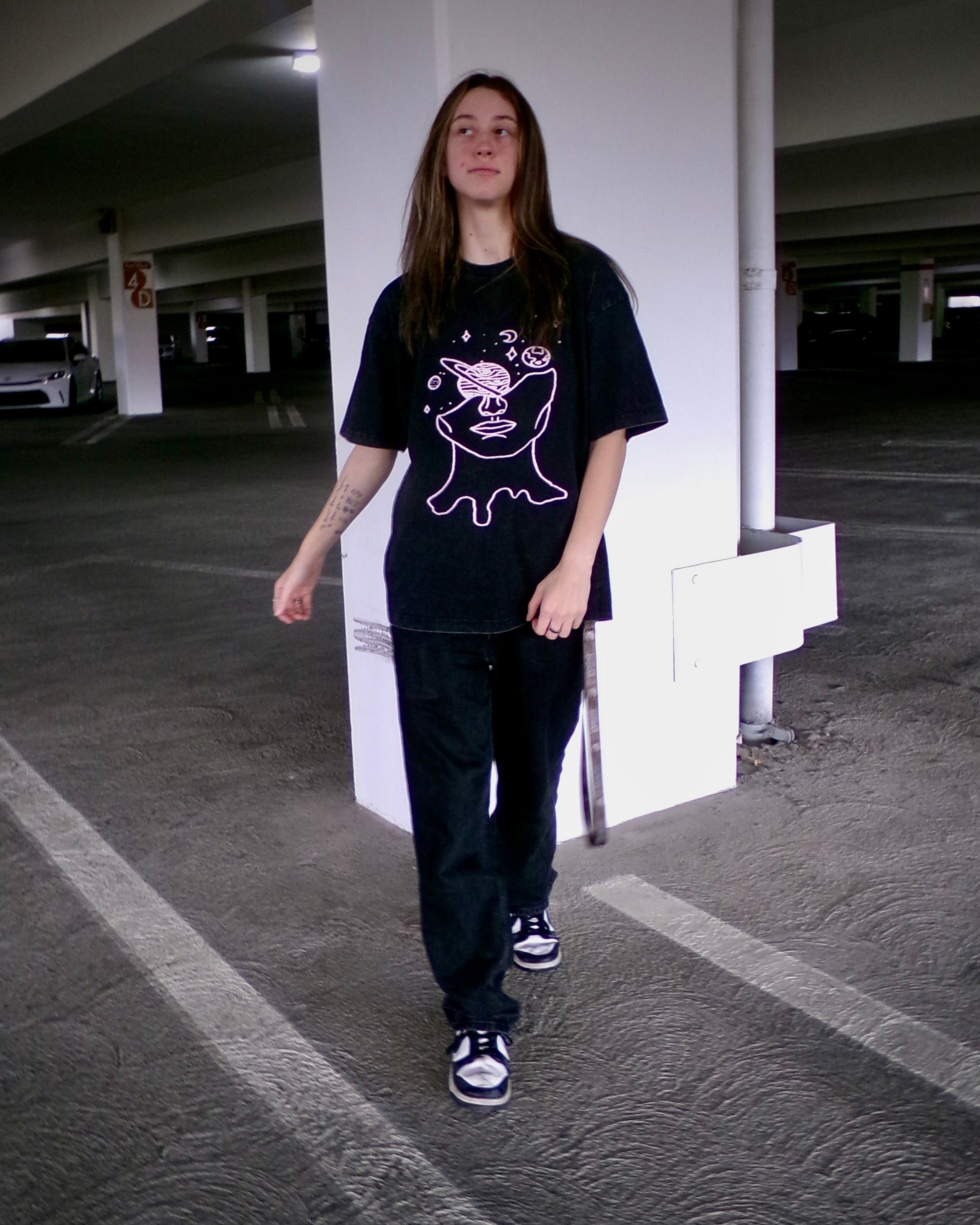 Model wearing the Lost in Thought tee
