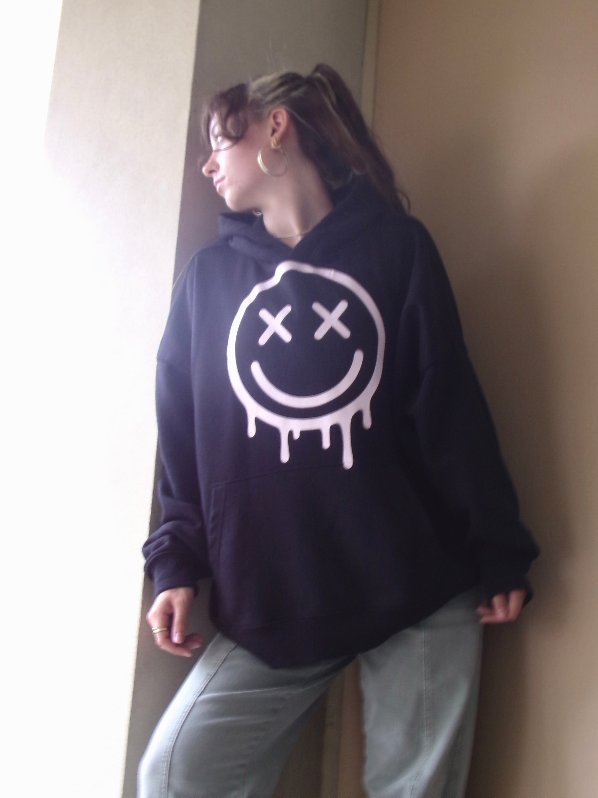 Model wearing the OUTSPOKEN Signature Hoodie