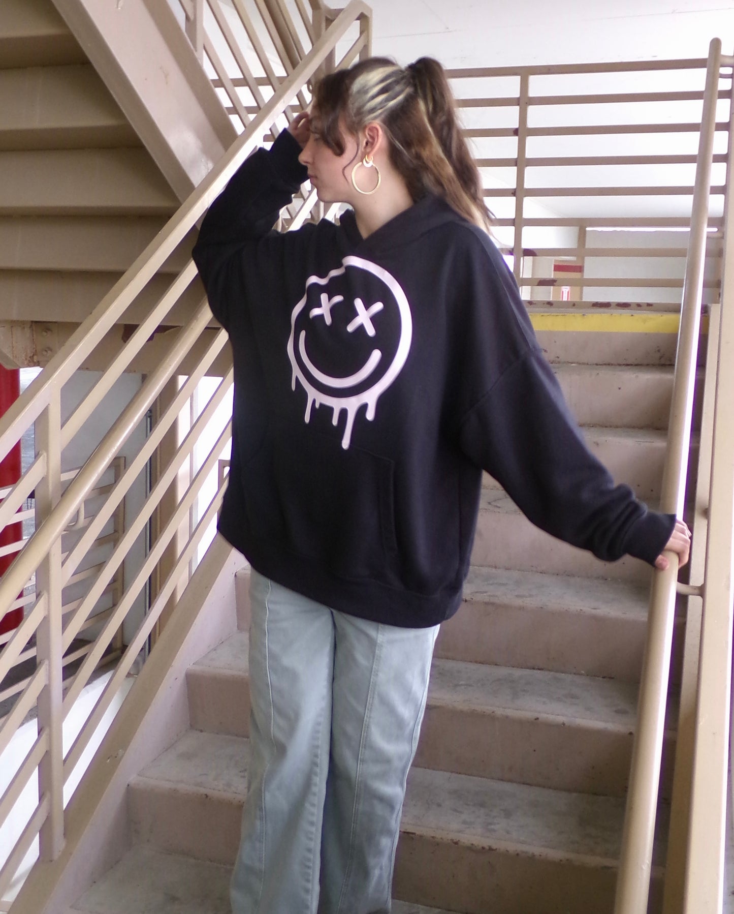 Model wearing the OUTSPOKEN Signature Hoodie
